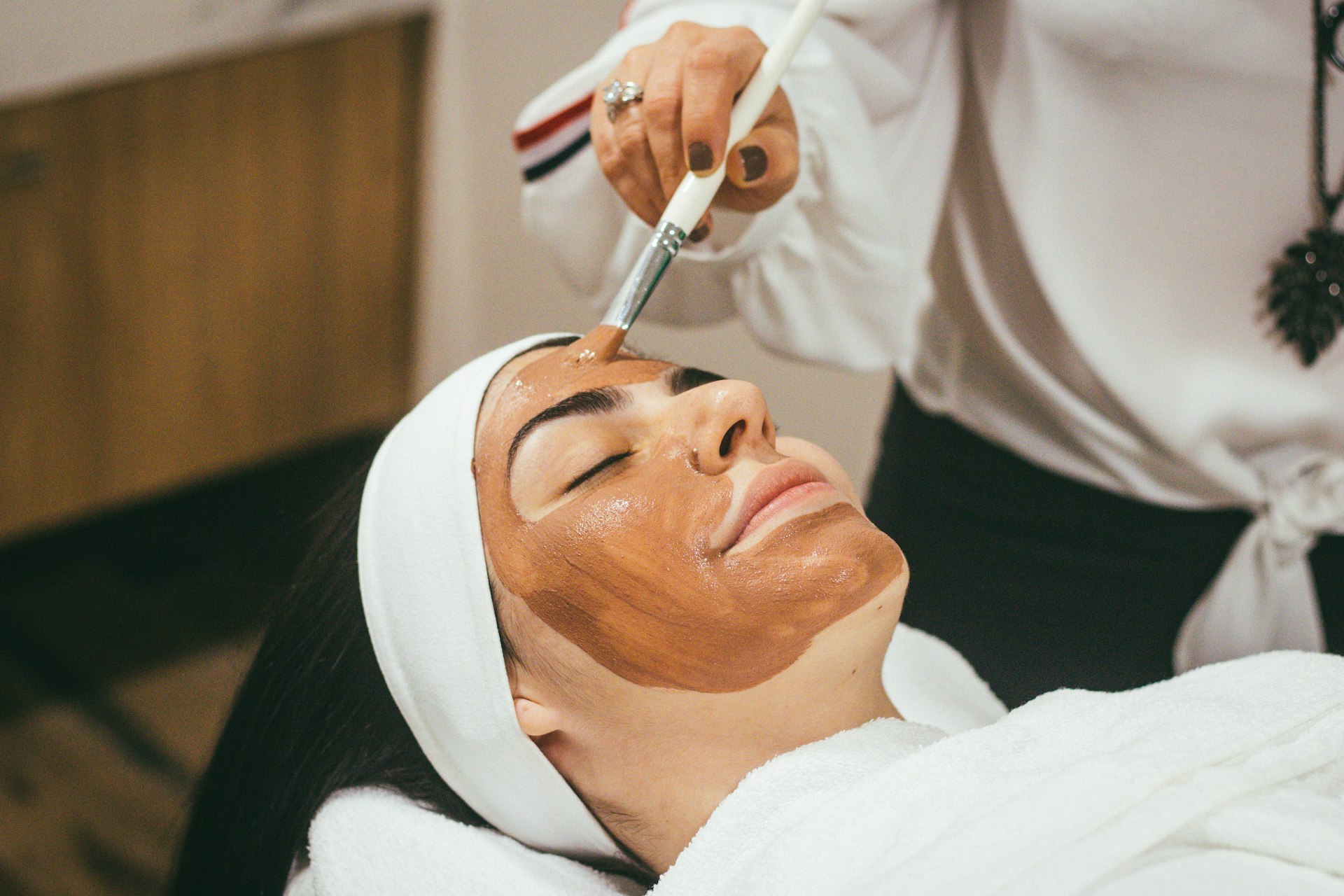 Elegant skincare and beauty treatment in a soft-lit setting